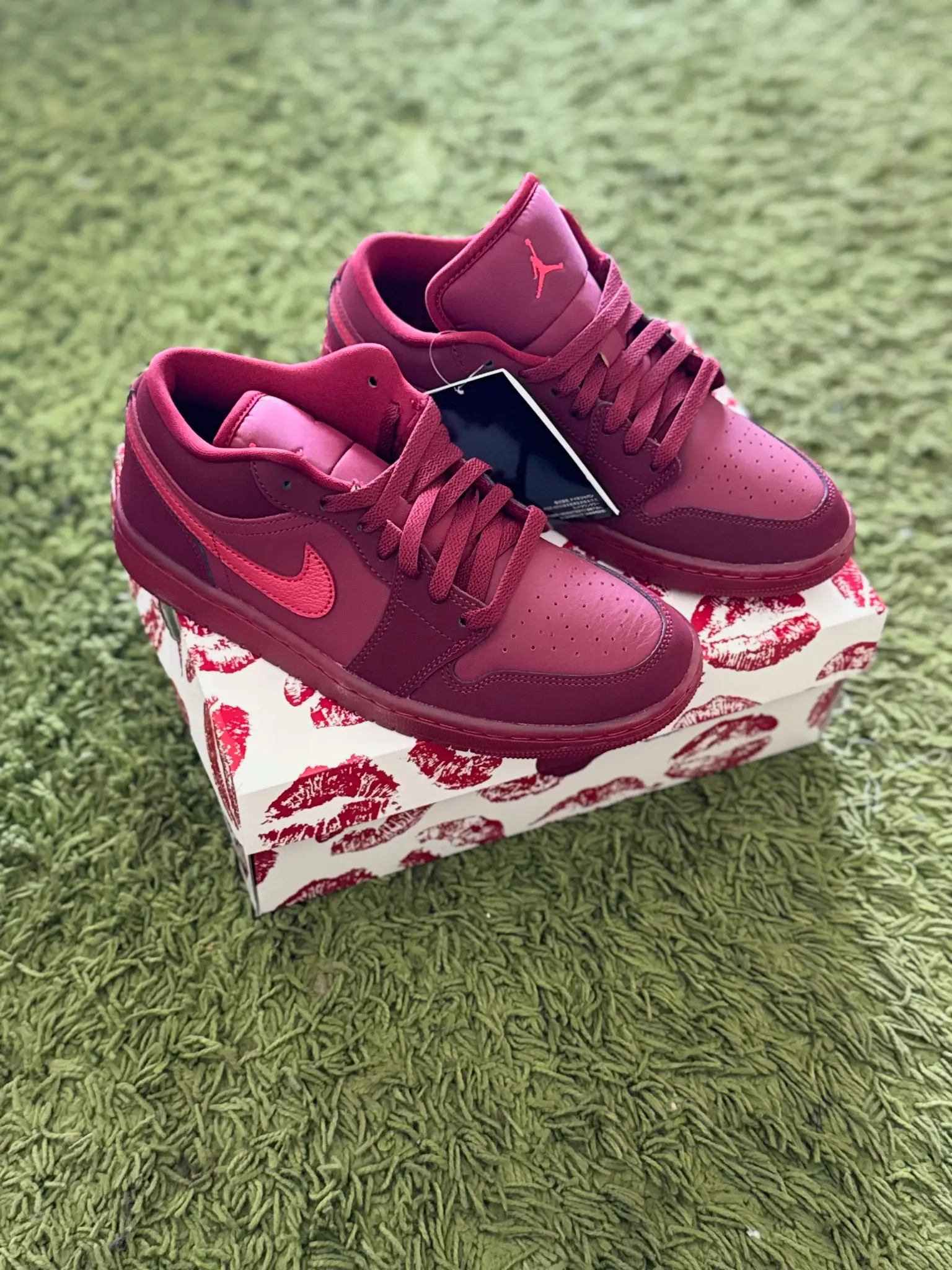 Pair of pink and purple Jordan high-top sneakers